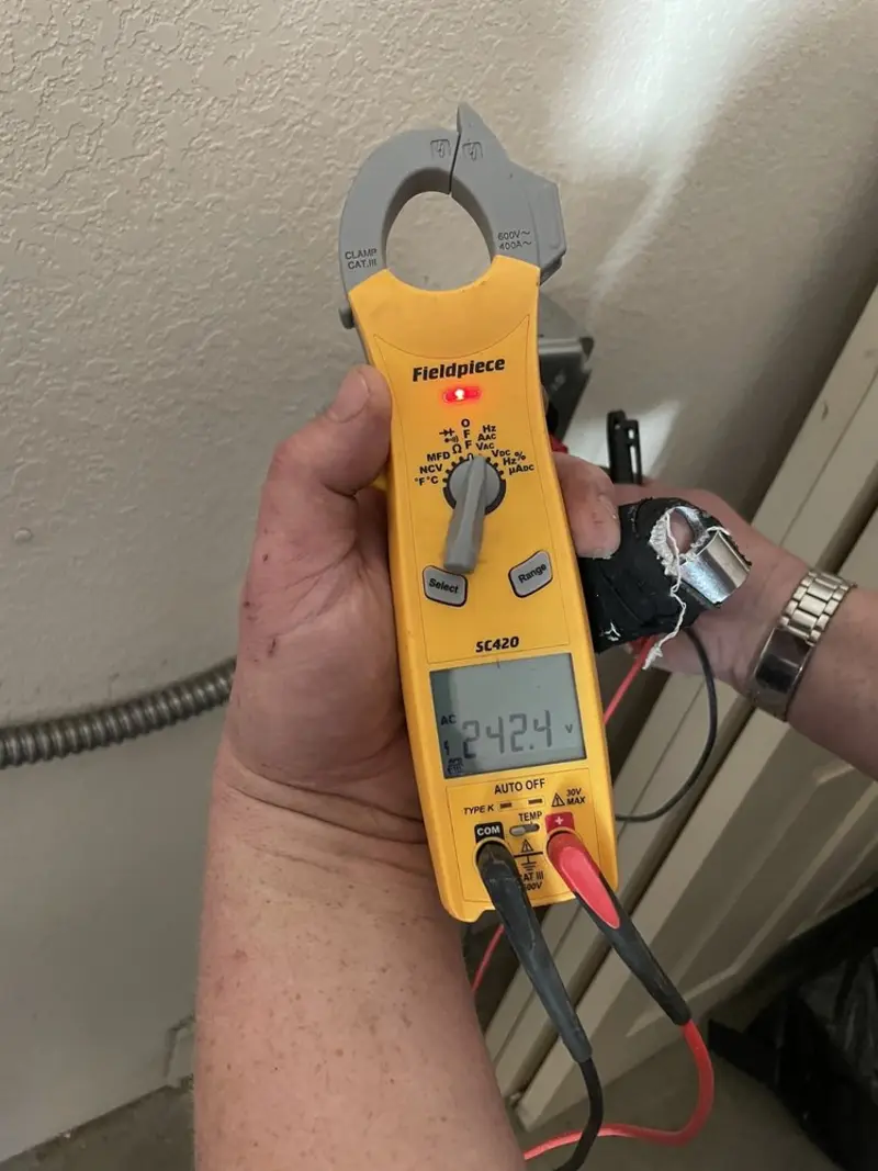 Voltage testing with clamp meter during Outlet Installation in Oatfield